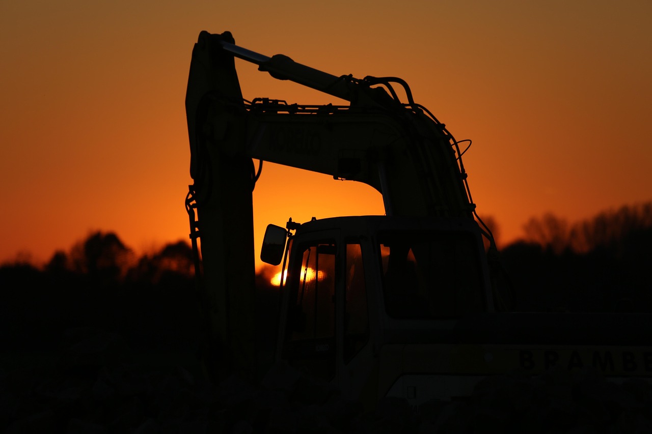"A split-screen image showcasing construction machine control technology: on the left, a bulldozer leveling soil at a construction site under a clear sky; in the center, a digital display showing real-time 3D terrain data for machine control; on the right, an excavator performing precise grading work in a similar outdoor setting."