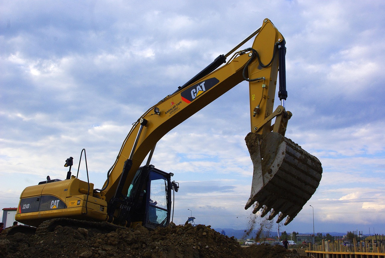 "A split-screen image showcasing construction machine control technology: on the left, a bulldozer leveling soil at a construction site under a clear sky; in the center, a digital display showing real-time 3D terrain data for machine control; on the right, an excavator performing precise grading work in a similar outdoor setting."